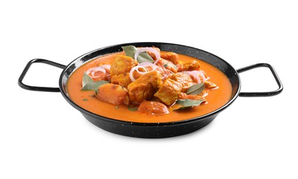 Delicious chicken curry in pan on white background