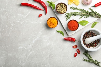 Photo of Flat lay composition with different aromatic spices and space for text on table