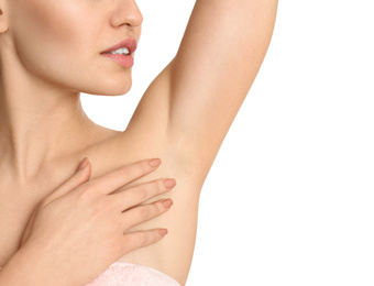 Photo of Young woman showing armpit with smooth clean skin on white background, closeup