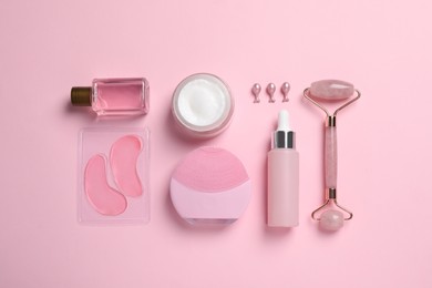 Photo of Flat lay composition with skin care products and accessories on pink background