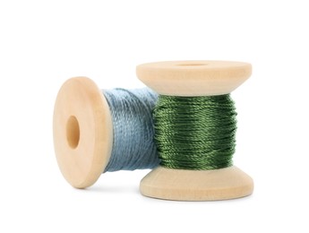 Different colorful sewing threads on white background