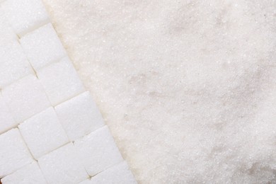 Different types of white sugar as background, top view. Space for text