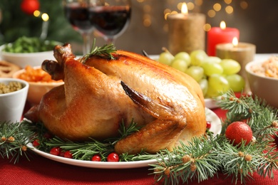 Photo of Traditional festive dinner with delicious roasted turkey served on table