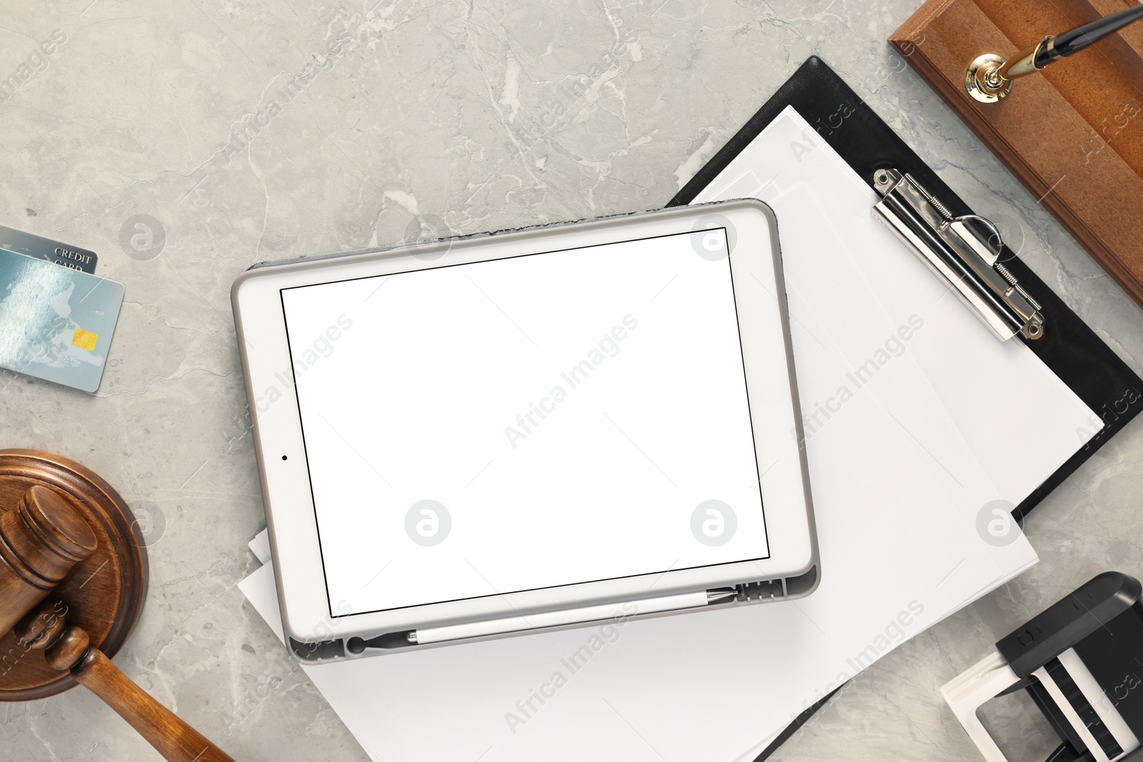 Photo of Flat lay composition with modern tablet on gray marble table. Space for text