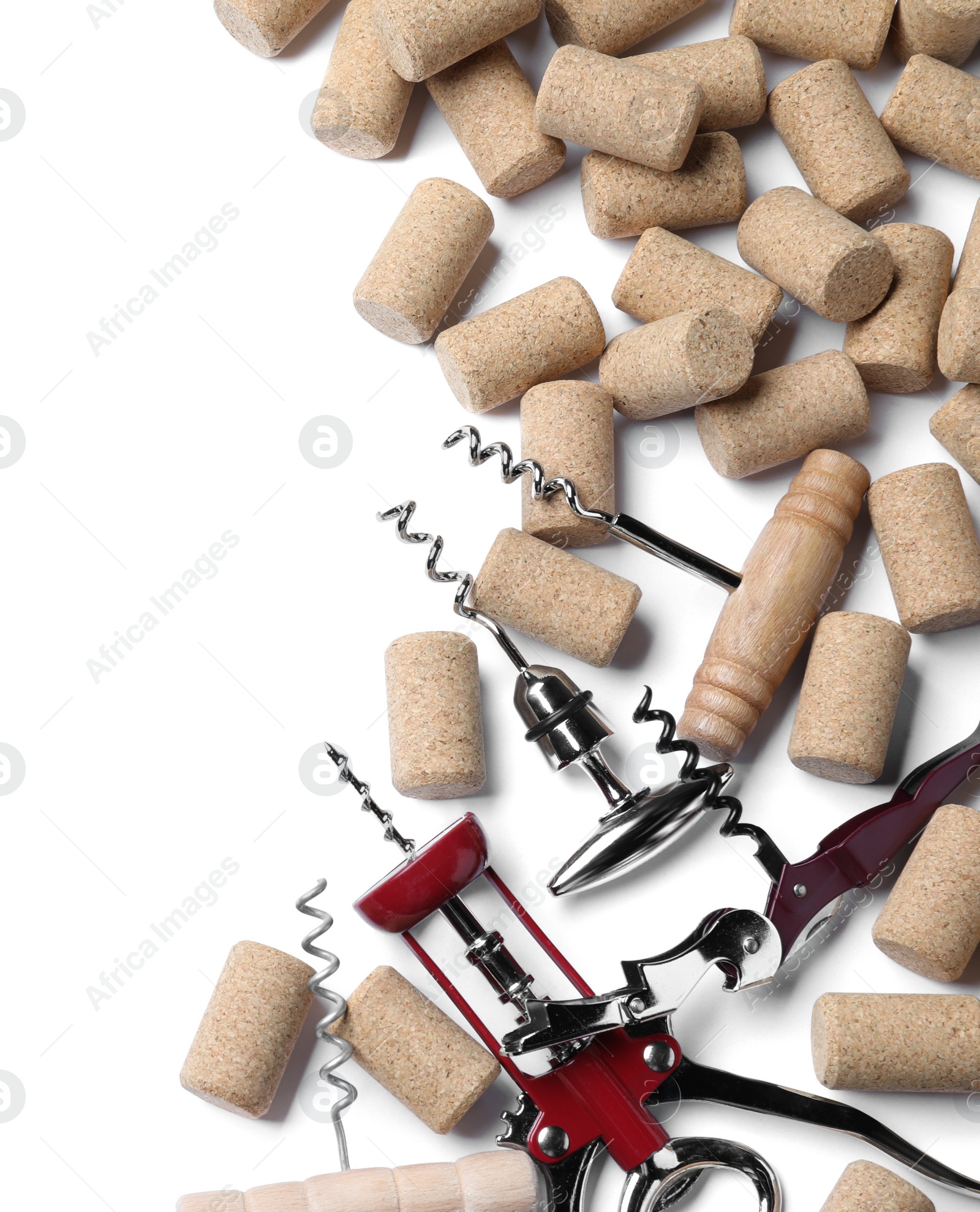 Photo of Different corkscrews and wine bottle stoppers on white background, top view