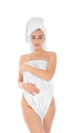 Portrait of young pretty woman with towels on white background