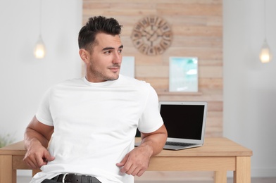 Portrait of handsome young man at home