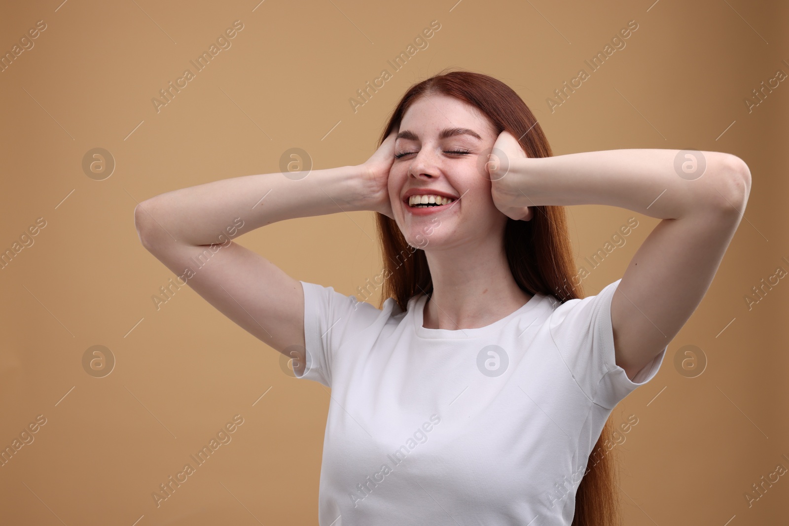 Photo of Portrait of smiling woman on beige background