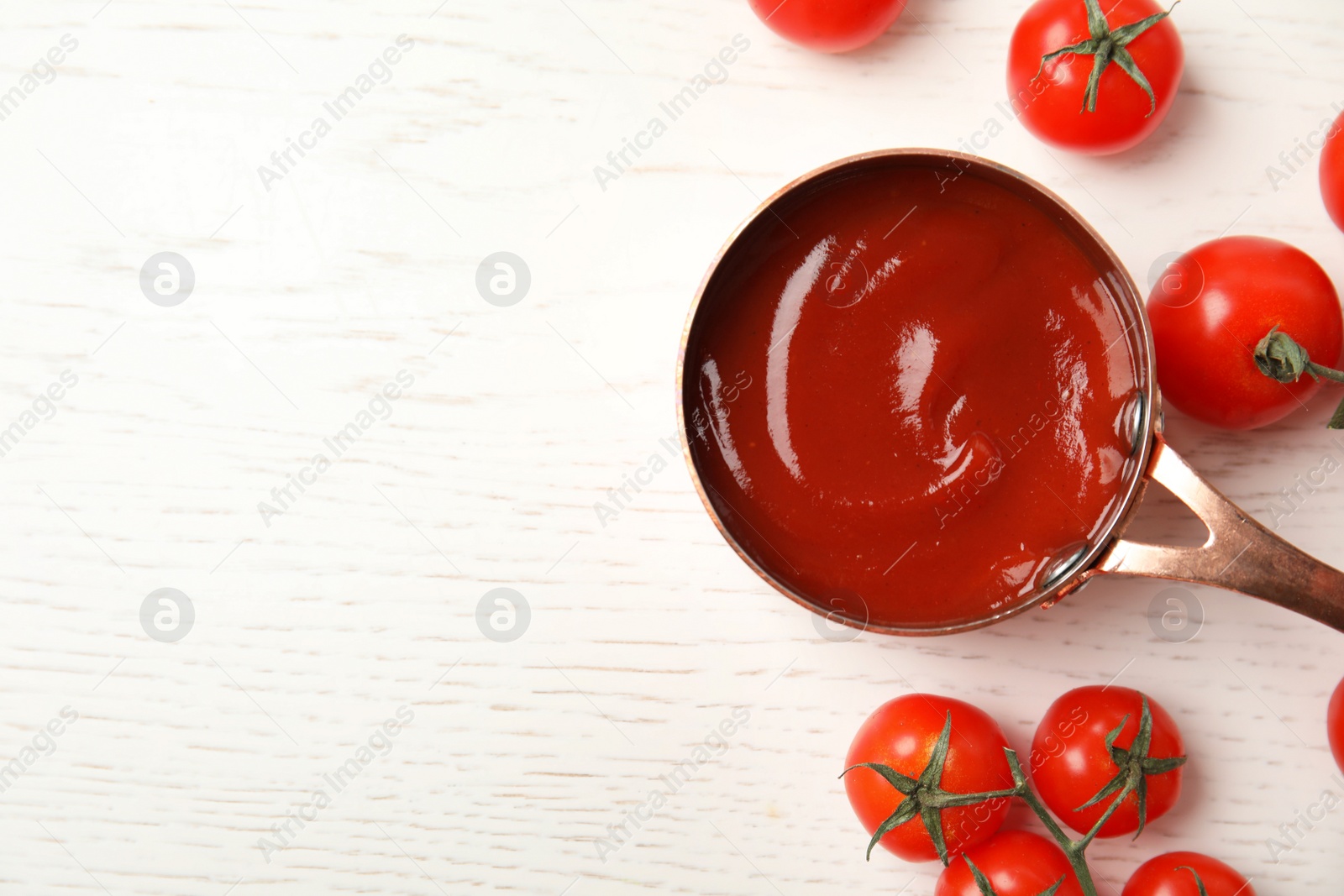 Photo of Composition with tasty homemade tomato sauce and space for text on white wooden background, top view