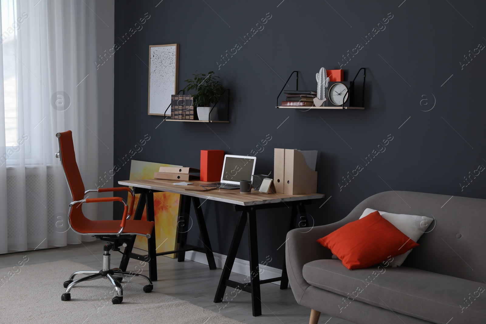 Photo of Modern workplace with comfortable chair in stylish home office interior