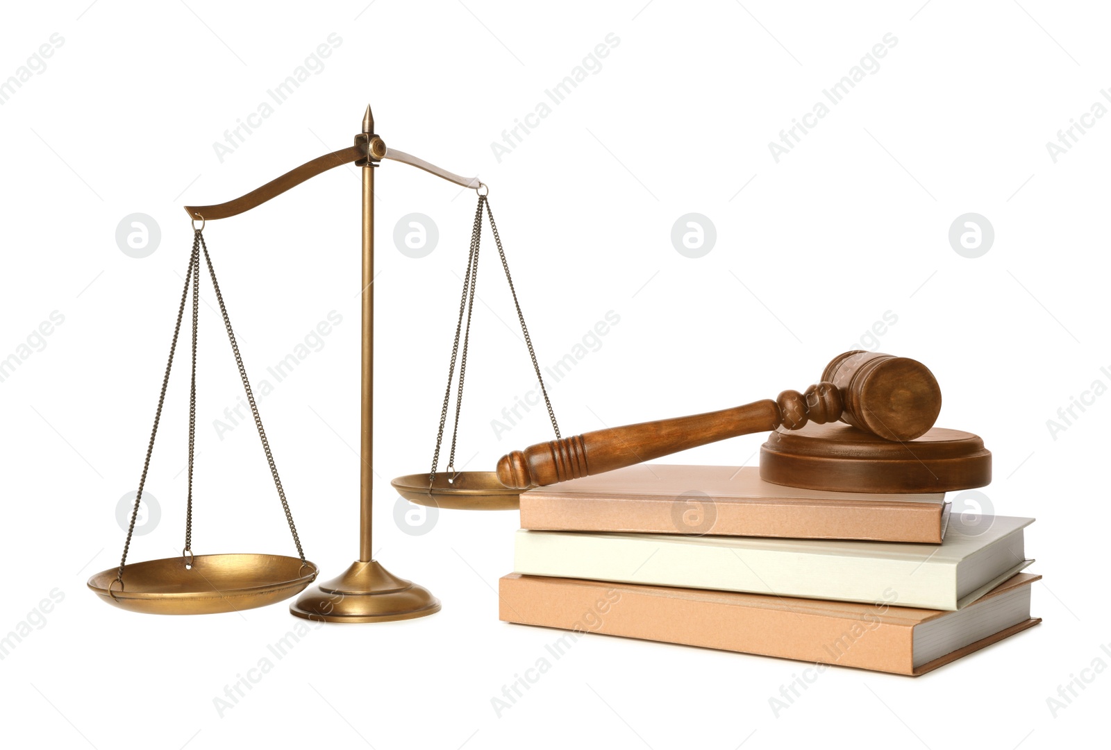 Photo of Wooden gavel, books and scales of justice on white background