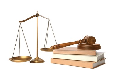 Photo of Wooden gavel, books and scales of justice on white background