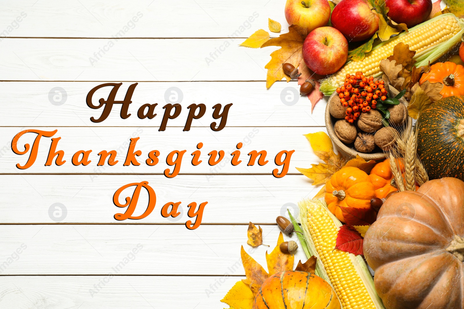 Image of Happy Thanksgiving Day card. Flat lay composition with ripe pumpkins and autumn leaves on white wooden table