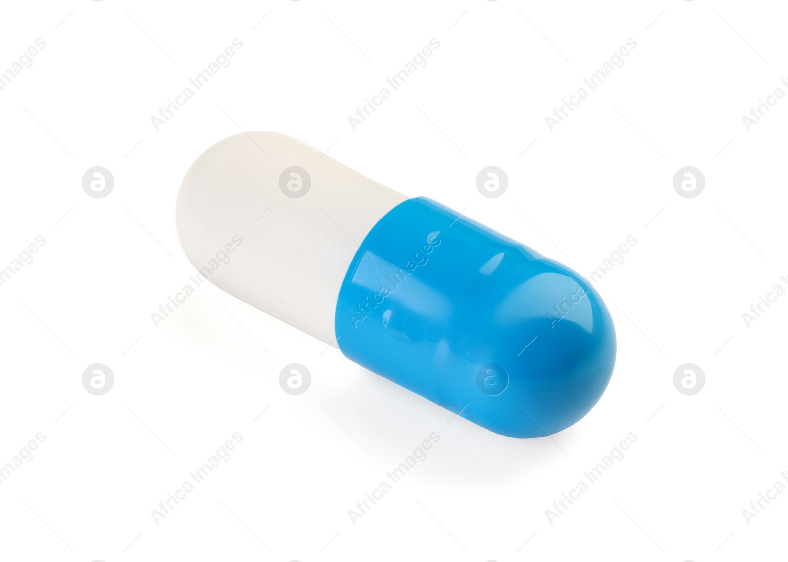 Photo of One antibiotic pill isolated on white. Medicinal treatment