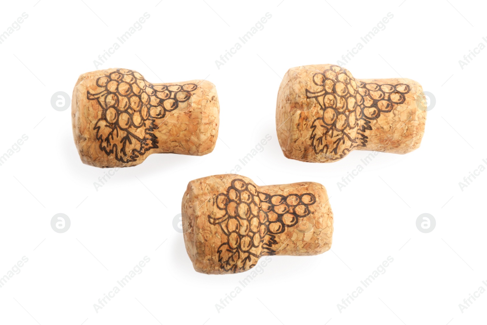 Photo of Sparkling wine corks with grape images on white background, top view