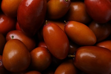 Photo of Closeup view of fresh Ziziphus jujuba fruits as background