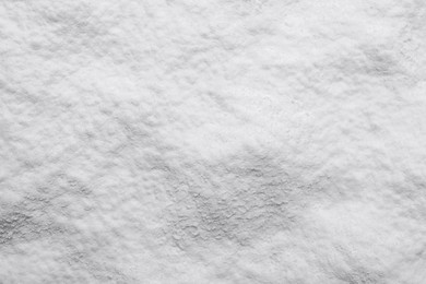 Heap of natural starch as background, top view