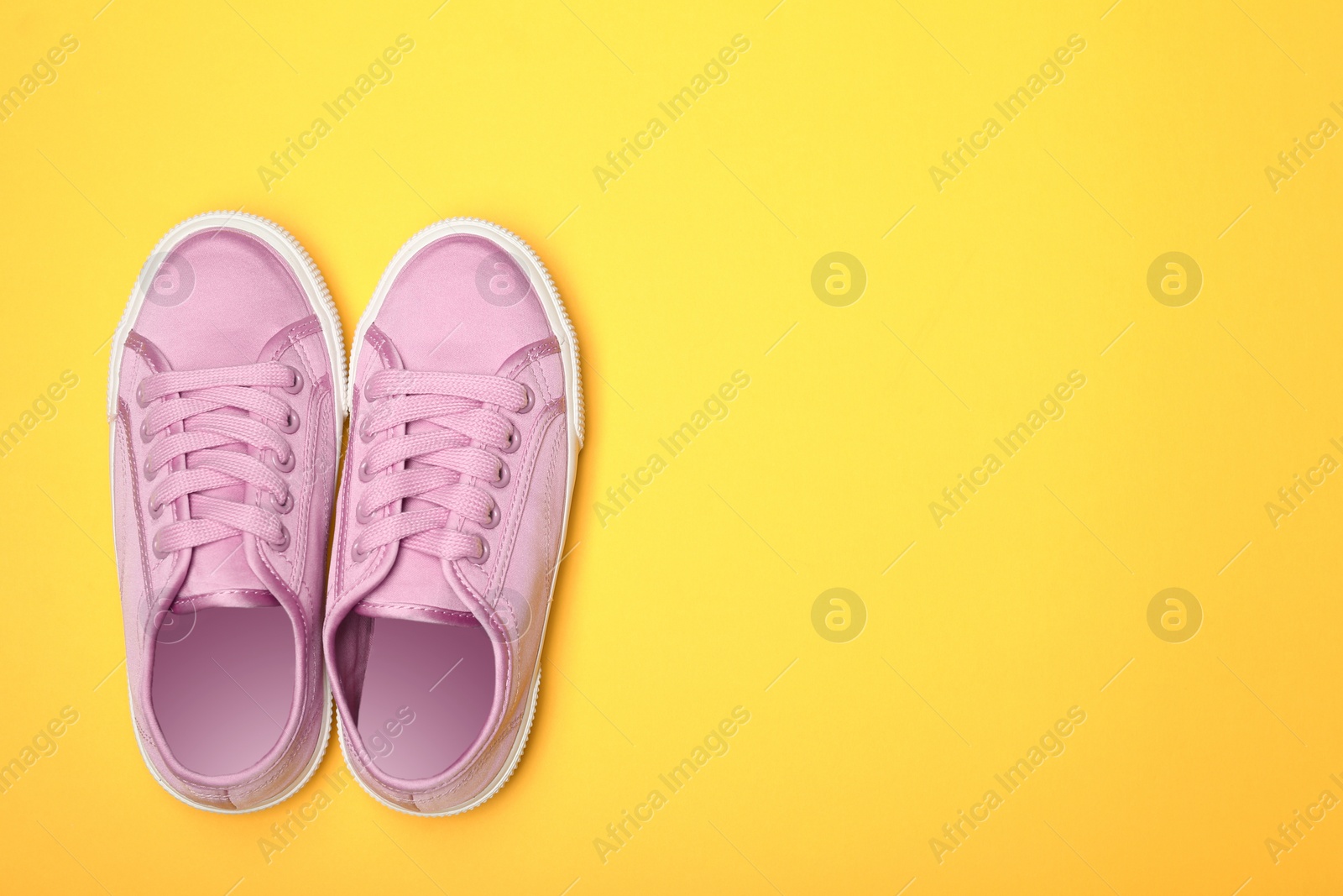 Photo of Stylish new shoes on color background, top view