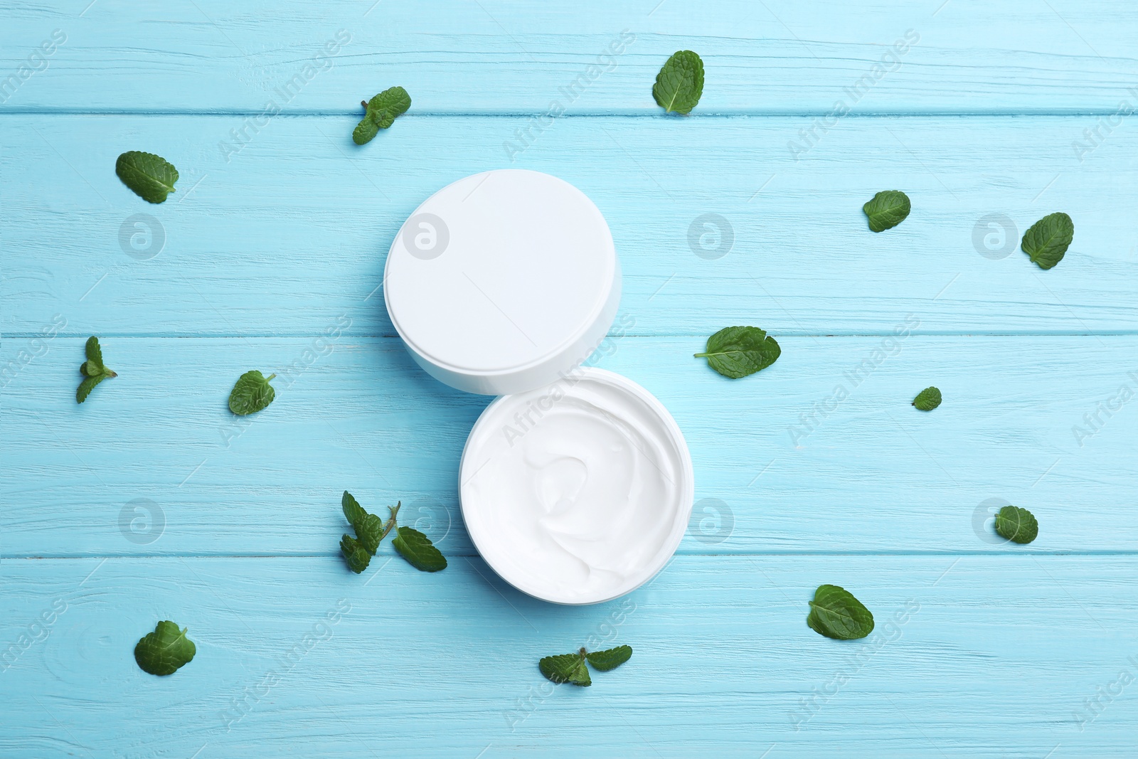 Photo of Jar with natural body cream on wooden background