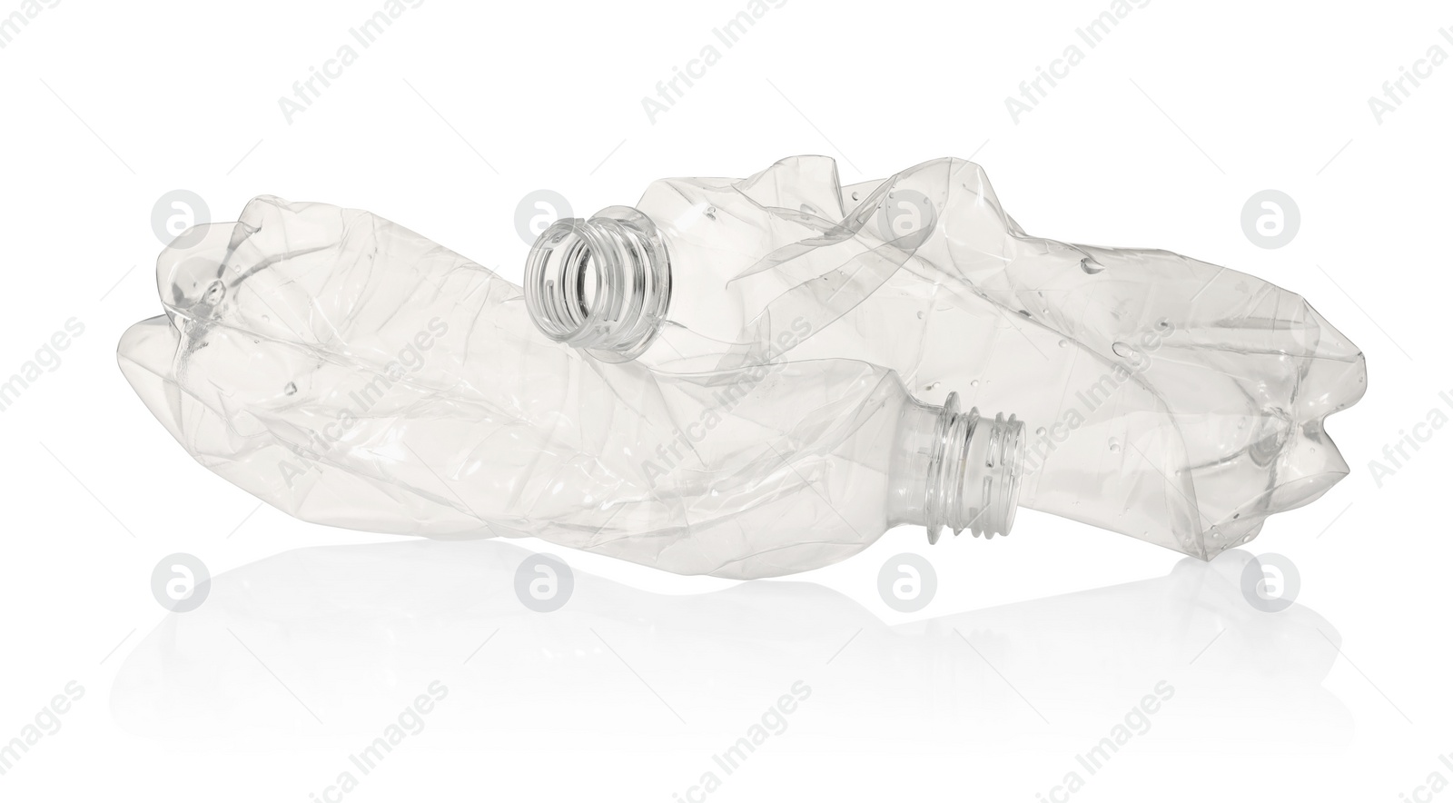 Photo of Crumpled disposable plastic bottles isolated on white