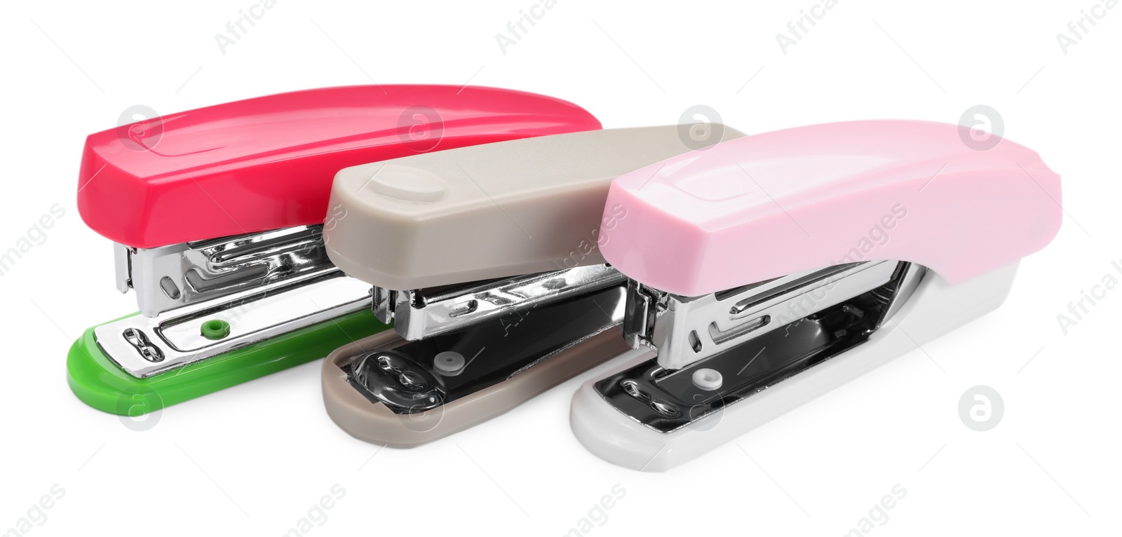 Photo of Many new bright staplers isolated on white