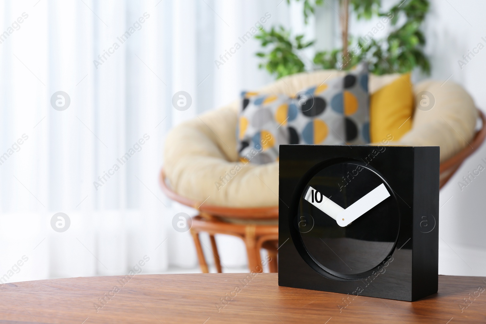 Photo of Analog clock on table indoors, space for text. Time management
