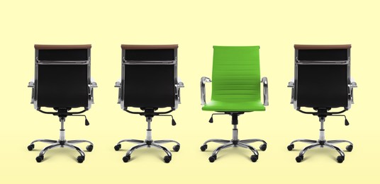 Image of Vacant position. Green office chair among black ones on beige background, banner design