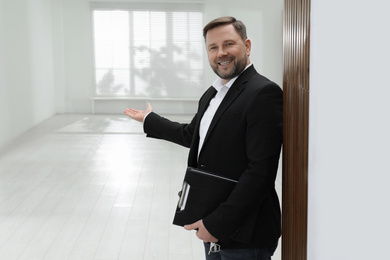 Male real estate agent showing new apartment
