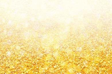 Image of Blurred view of gold glitter as abstract background, bokeh effect