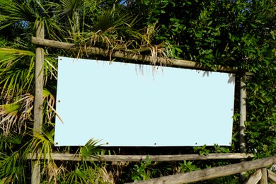 Photo of Blank banner in tropical park outdoors on sunny day