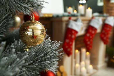 Blurred view of beautiful festive interior, focus on decorated Christmas tree