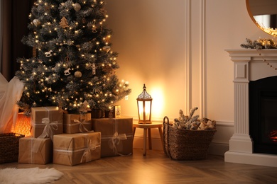 Beautiful living room interior with decorated Christmas tree and gifts