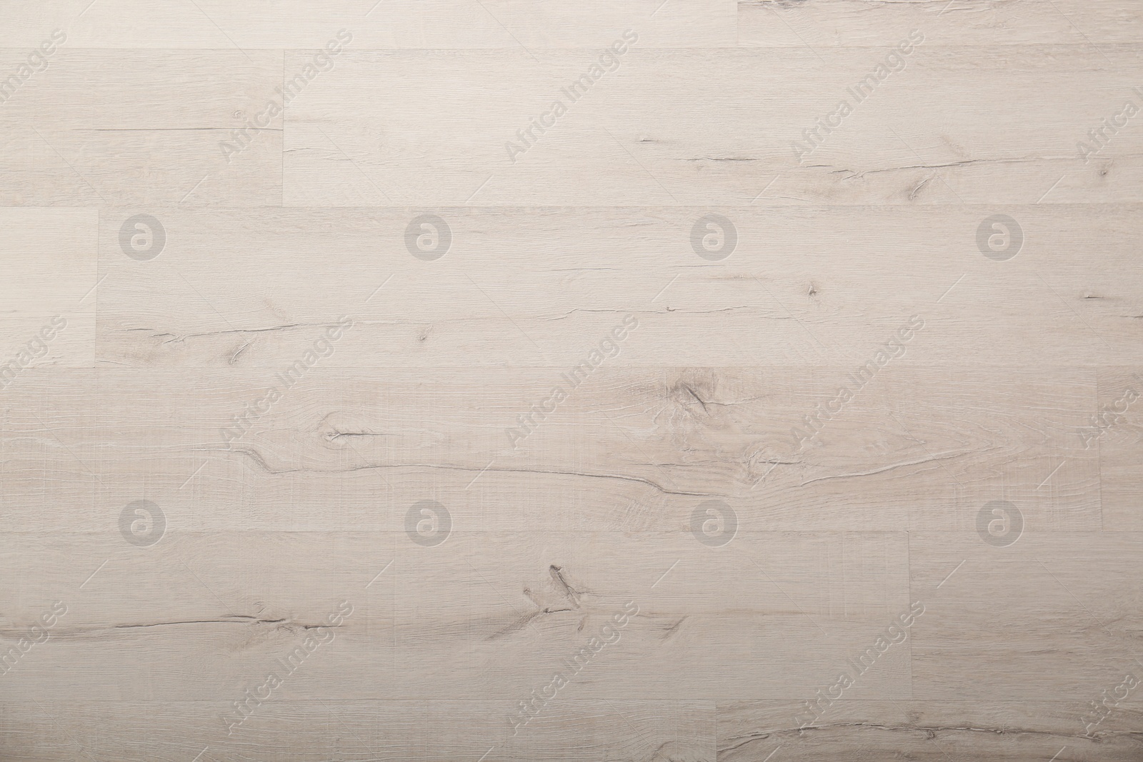 Photo of Light wooden laminate as background, top view. Floor covering