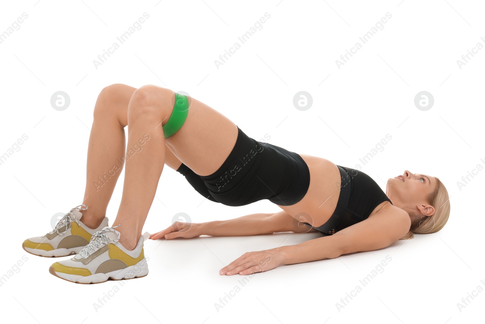 Photo of Woman exercising with elastic resistance band on white background