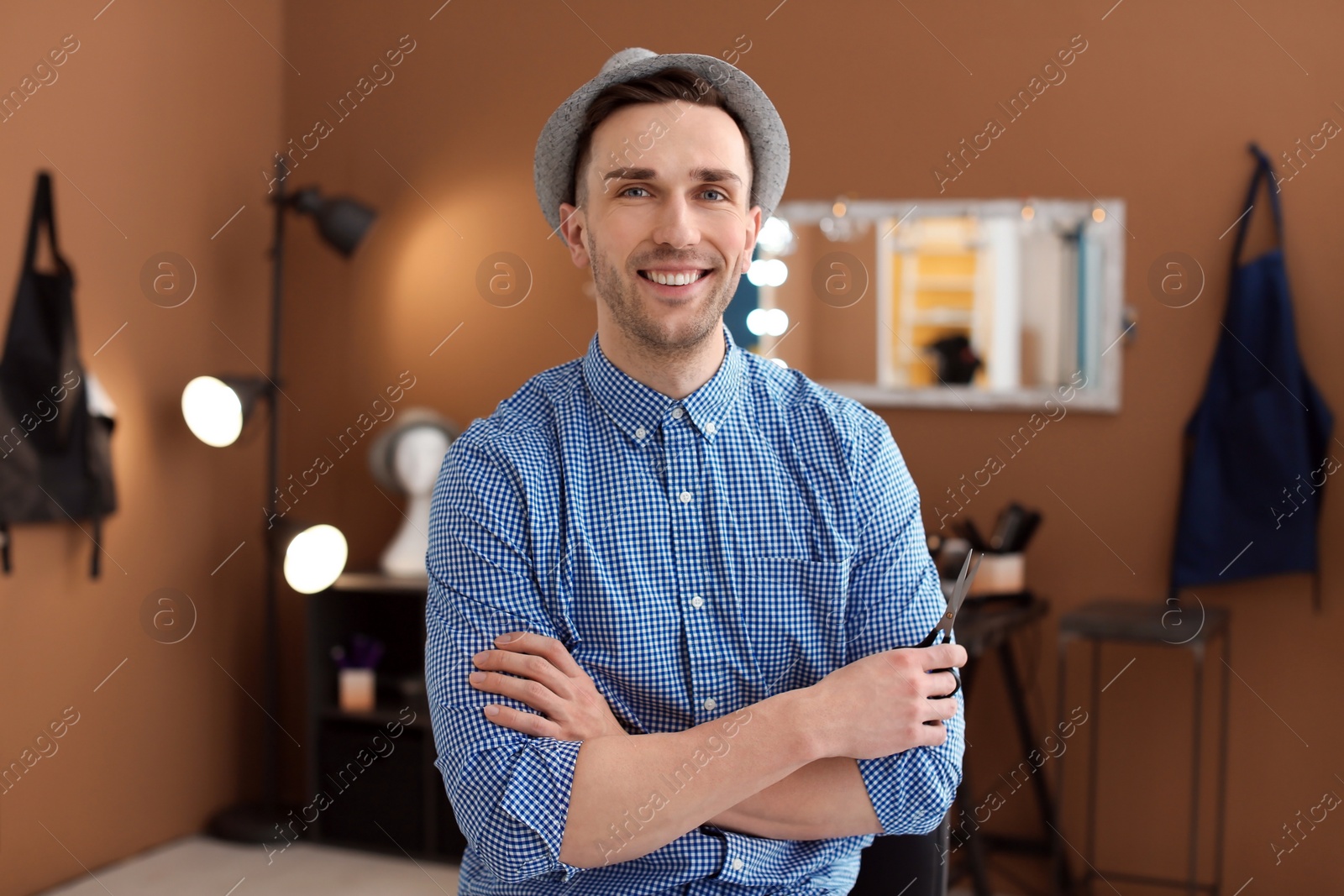 Photo of Professional hairdresser in beauty salon