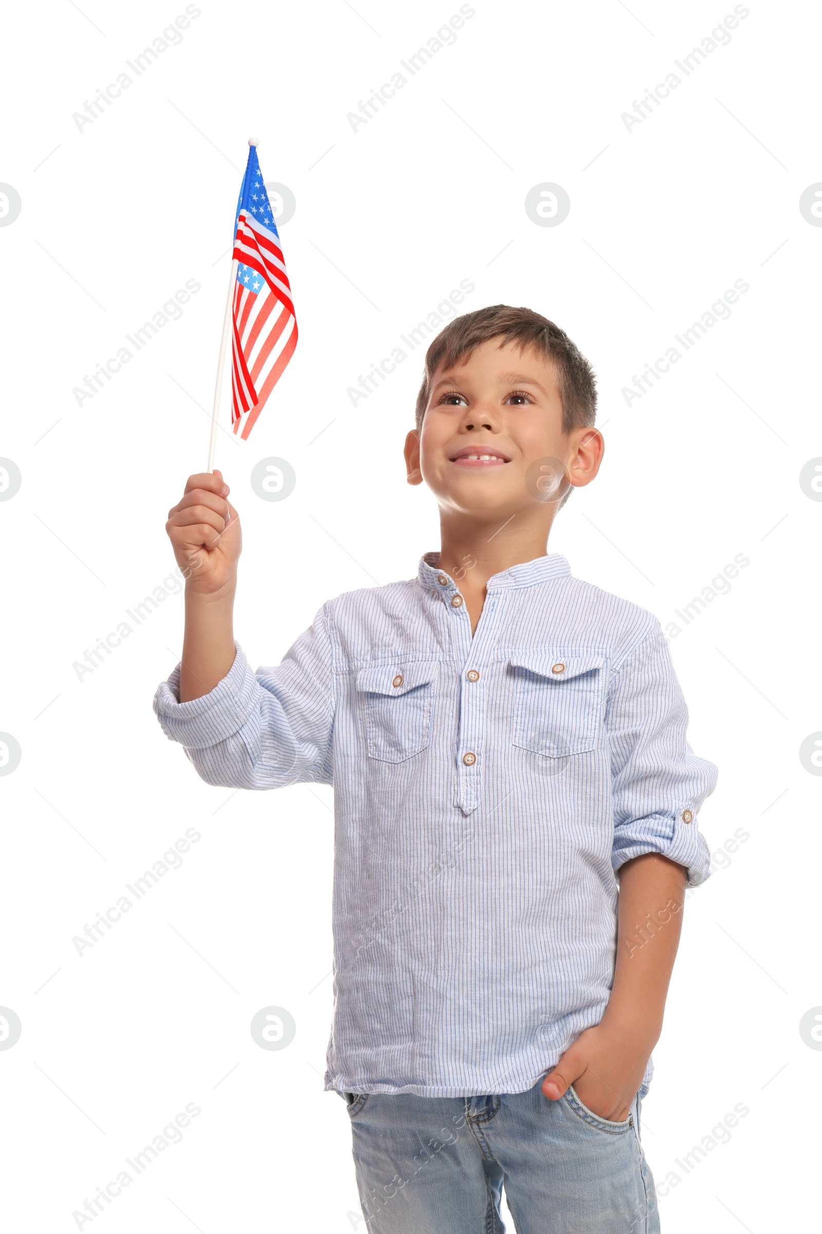 Photo of Portrait of cute little boy with American flag on white background