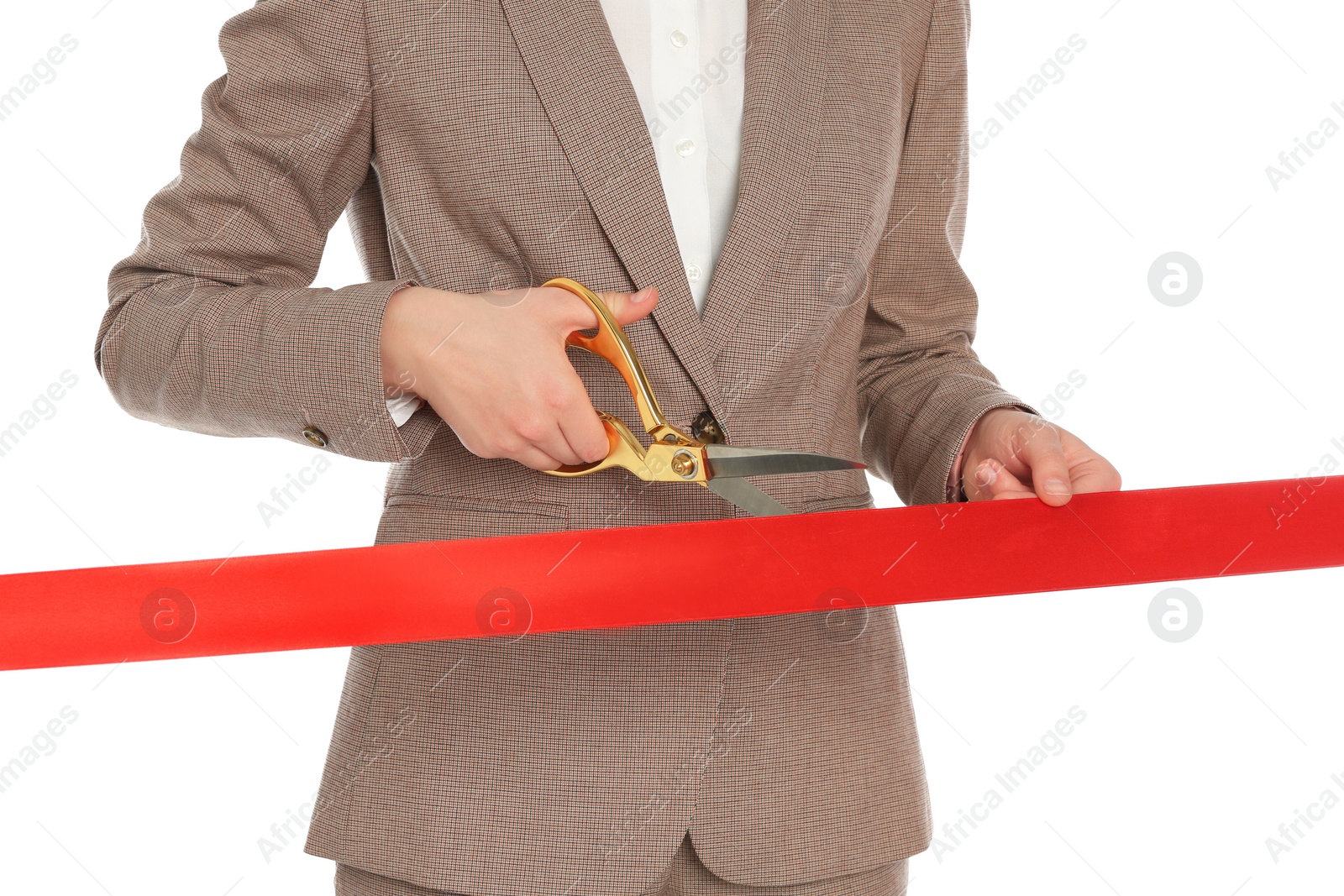 Photo of Woman in office suit cutting red ribbon isolated on white, closeup