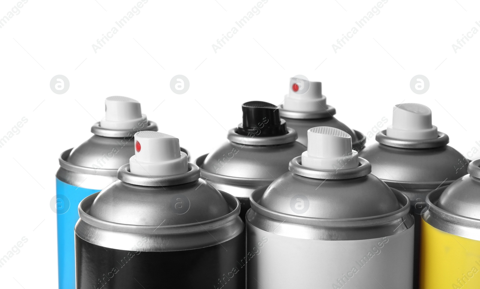 Photo of Cans of different spray paints on white background, closeup