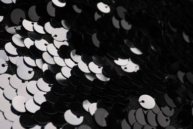 Beautiful black sequin fabric as background, closeup