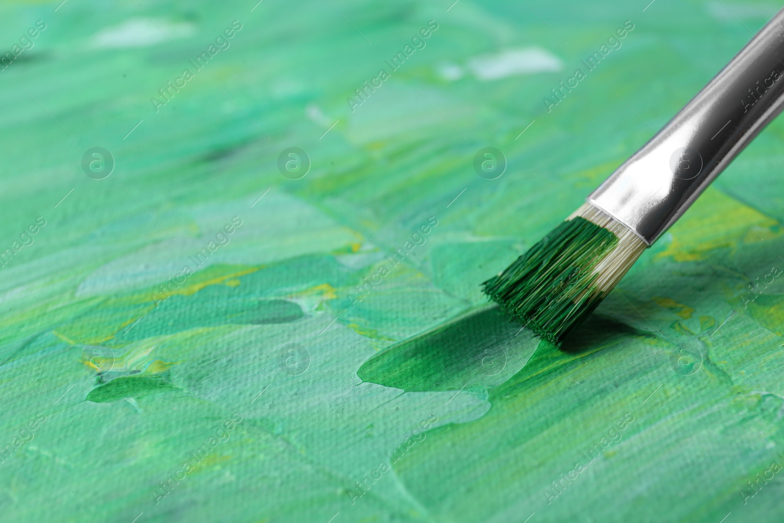 Photo of Abstract colorful paint and brush, closeup view