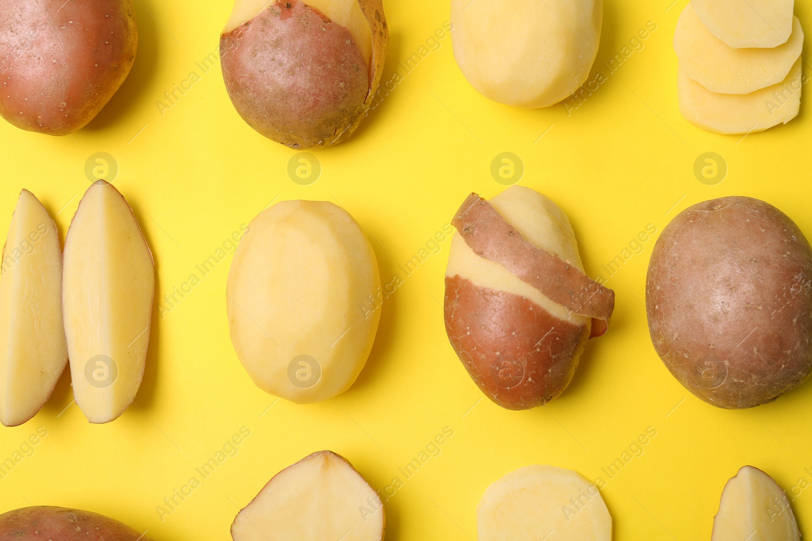 Photo of Flat lay composition with fresh organic potatoes on color background