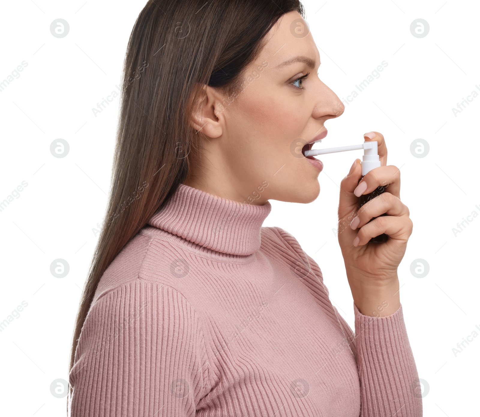 Photo of Woman using throat spray on white background