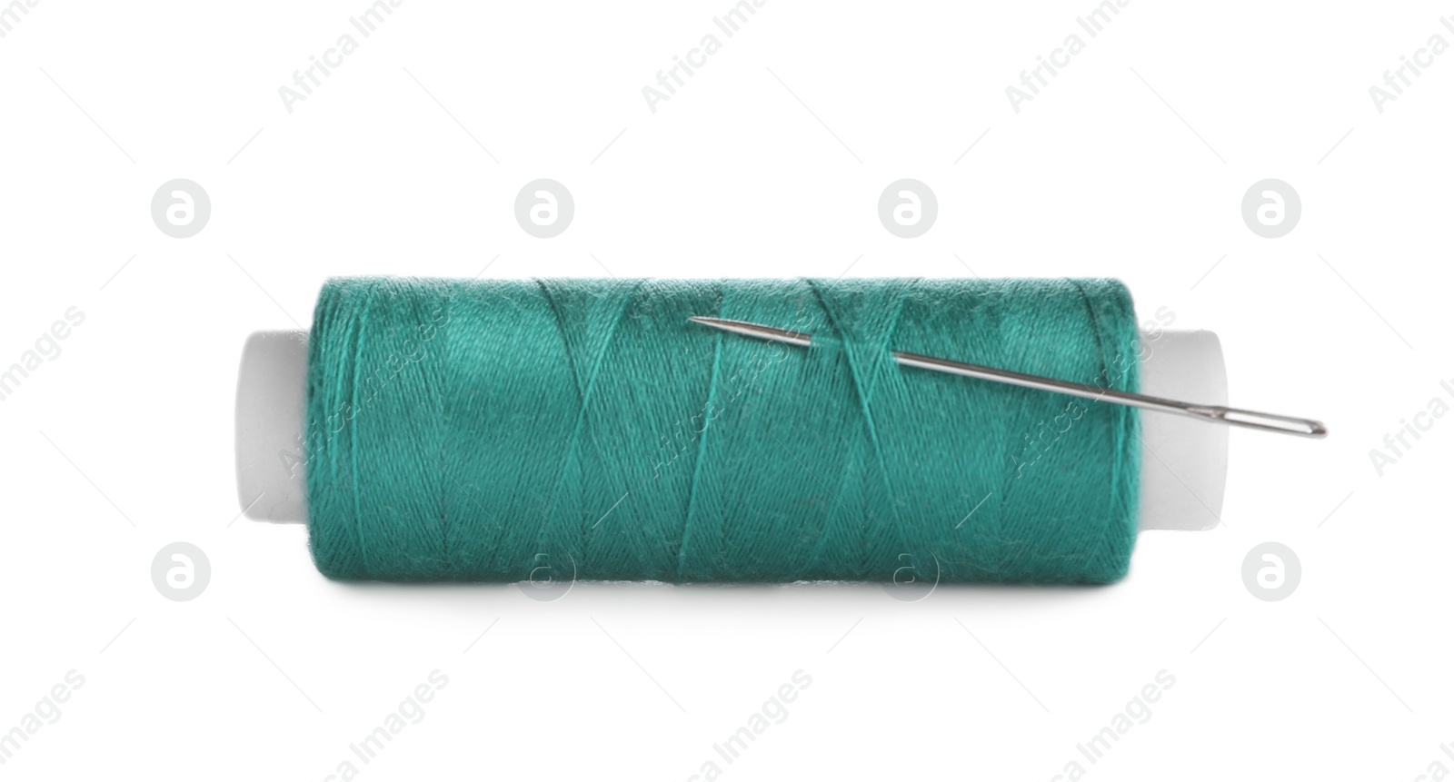 Photo of Bright sewing thread with needle isolated on white