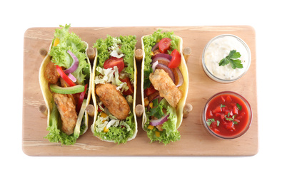Photo of Board with tasty fish tacos isolated on white, top view