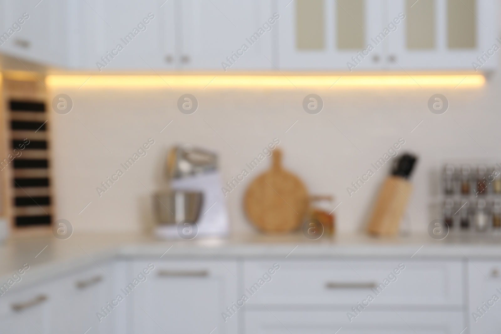 Photo of Blurred view of modern stylish kitchen interior