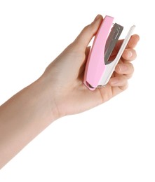 Woman holding pink stapler on white background, closeup