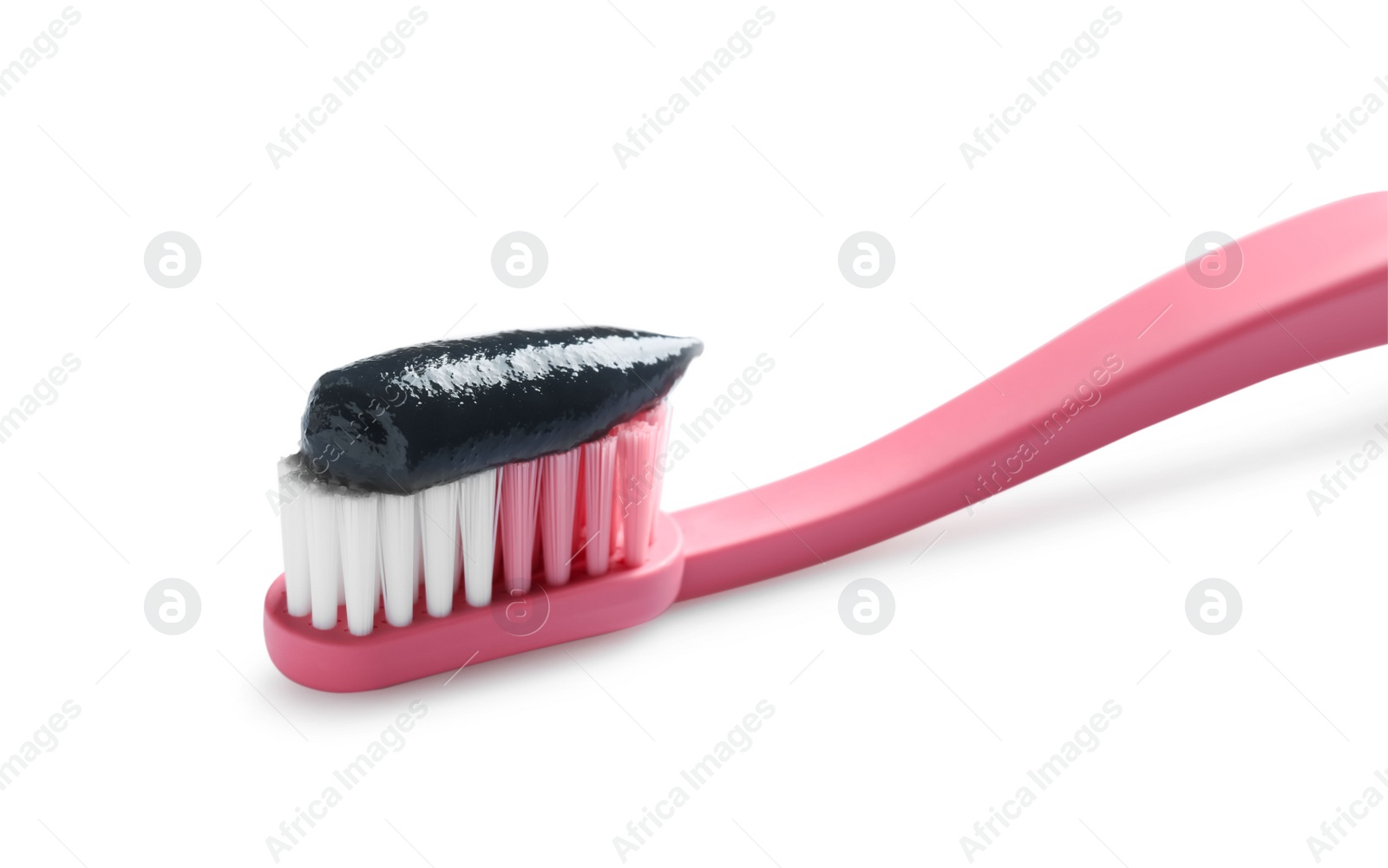 Photo of Brush with charcoal toothpaste isolated on white