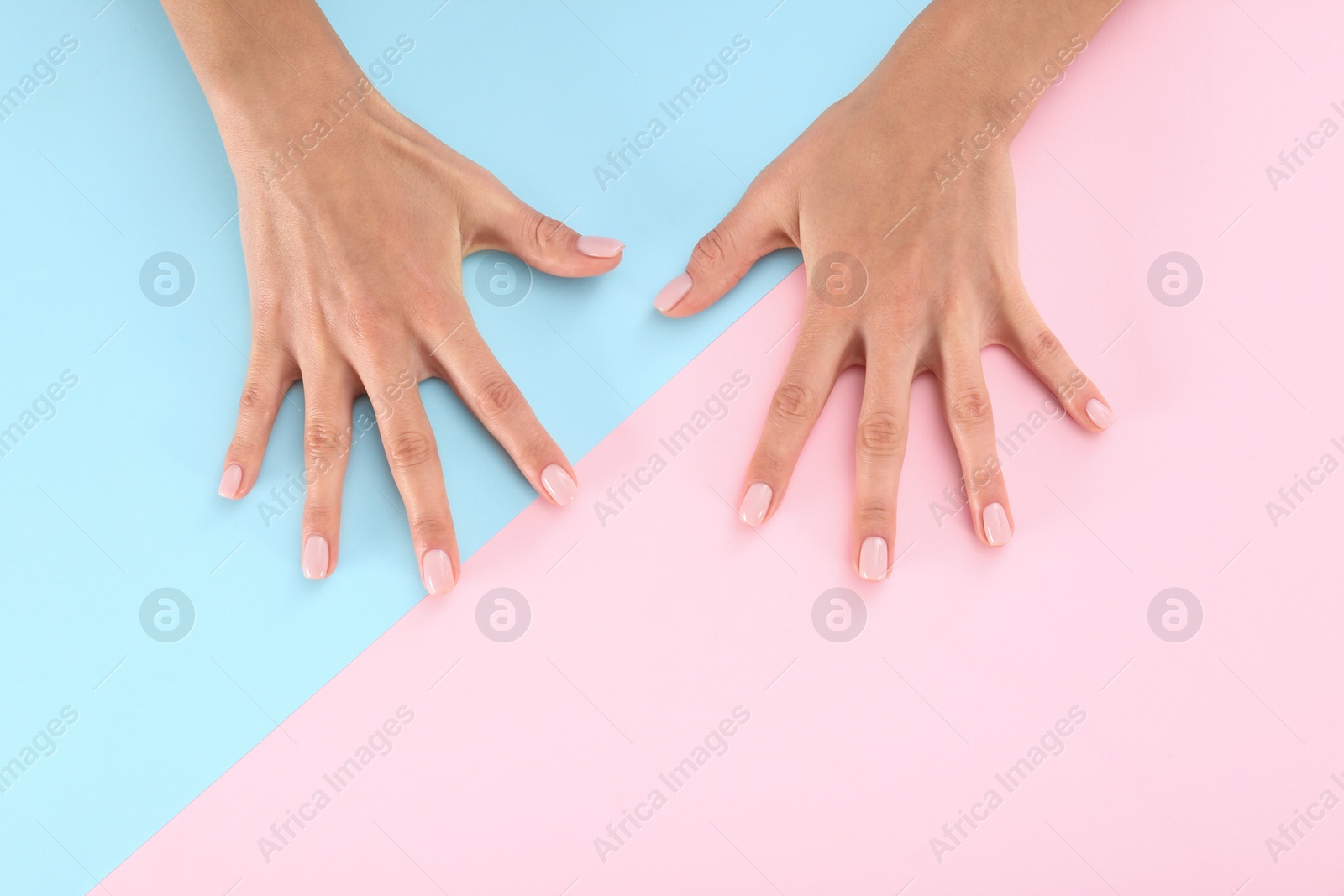 Photo of Closeup view of woman with beautiful hands on color background, space for text. Spa treatment