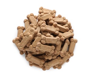 Photo of Pile of bone shaped dog cookies on white background, top view