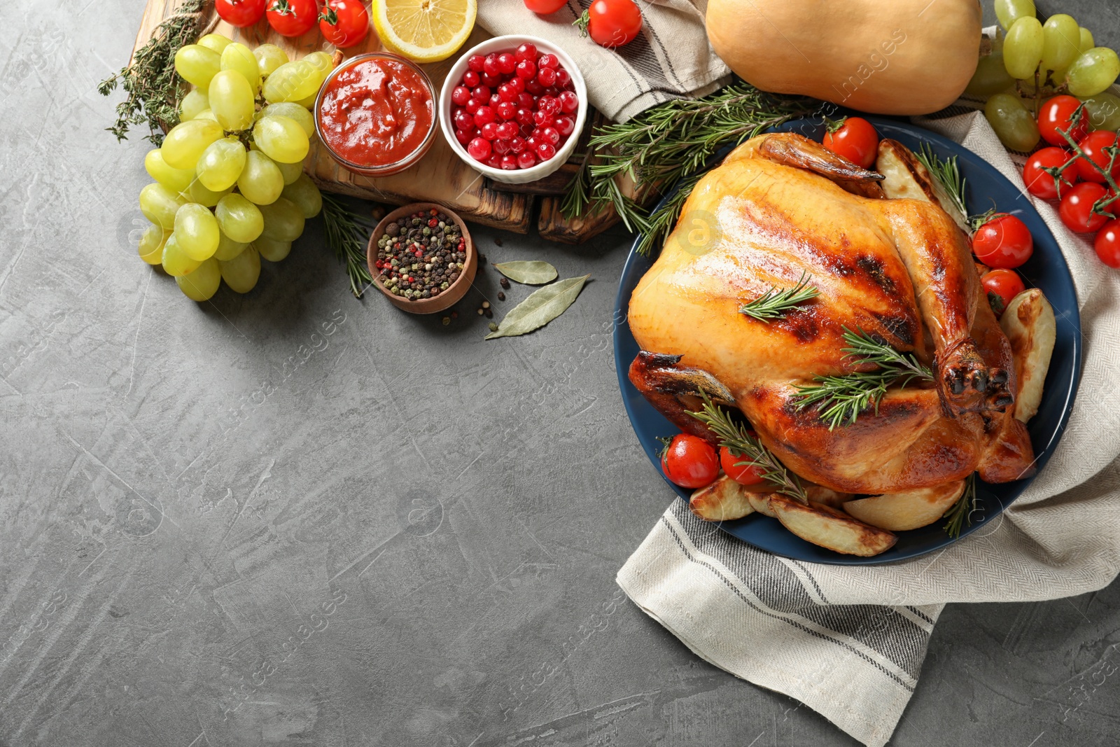Photo of Delicious roasted turkey on table, top view. Space for text